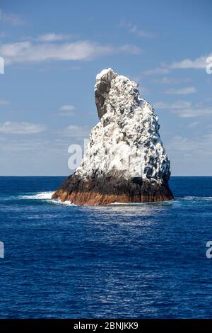 Roca Partida,  a small rock island covered in white bird guano  in the Revillagigedo Archipelago Biosphere Reserve, Socorro Islands, Western Mexico Stock Photo