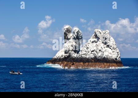 Roca Partida,  a small rock island covered in white bird guano  in the Revillagigedo Archipelago Biosphere Reserve, Socorro Islands, Western Mexico Stock Photo