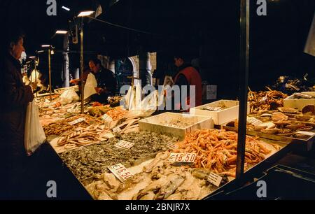 Rialto Fish Market and Vendors with Display of Freshly Caught Produce, Venice, Italy. (Scanned Fuji Transparency) Stock Photo