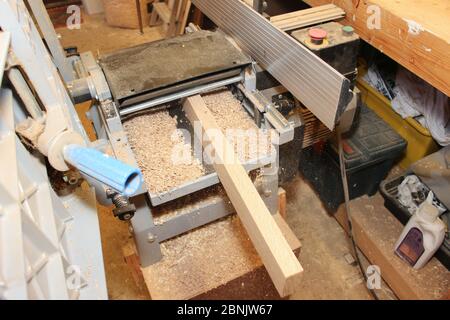 Planing timer on a Thickness Planer machine, wood planer thicknesser Stock Photo