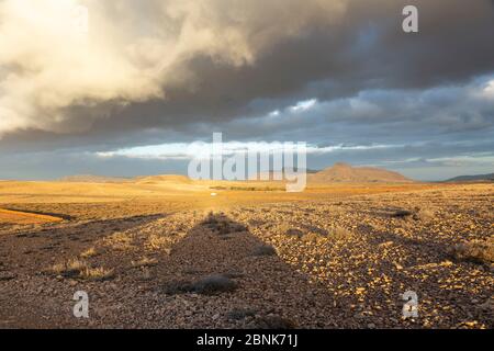 Dramatic clouds over volcanic landscape in Tuineje, Fuerteventura Stock Photo