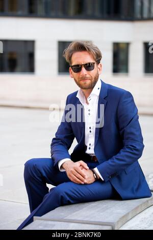 man in suit wearing sunglasses Stock Photo