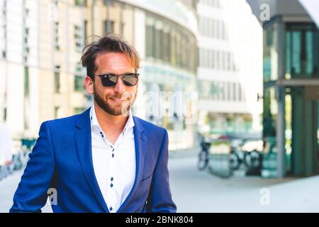 man in suit wearing sunglasses Stock Photo