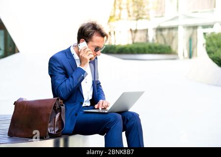 man working outside in Frankfurt Main, Germany Stock Photo
