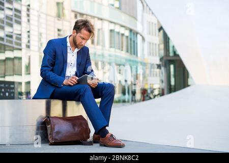 man working outside in Frankfurt Main, Germany Stock Photo