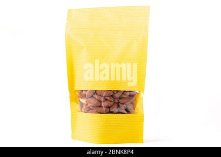 full yellow isolated paper doypack bag flat bottom flexible packaging with window zipper on white background Stock Photo