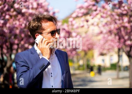 man working outside in Frankfurt Main, Germany Stock Photo