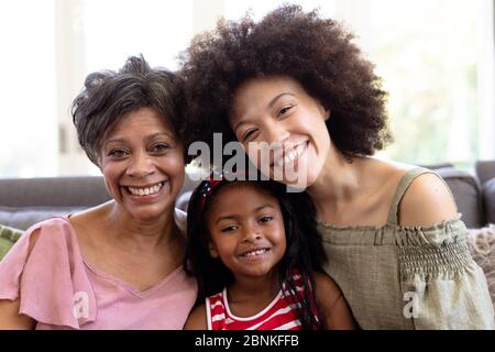 Multi-generation mixed-race family enjoying their time at home Stock Photo