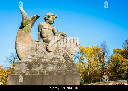 Sculpture: Angel rides on fish in the newly designed Kurpark in Bad Dürkheim, Stock Photo