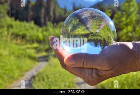 hand with crystal sphere Stock Photo