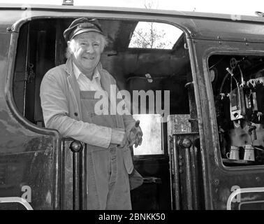 BW Steam Engine driver on footplate, heritage railway 80080, East Lancs Railway ELR, Bury, Greater Manchester, England, UK Stock Photo