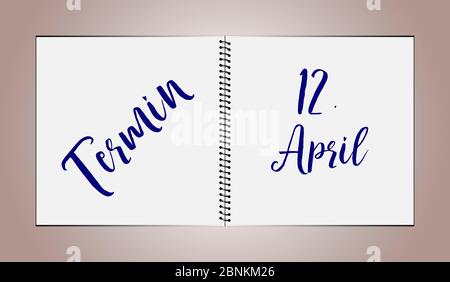 A desk diary shows the date April 12th Stock Photo