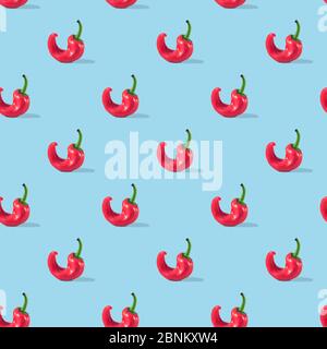 Ugly red pepper seamless pattern on blue background. Stock Photo