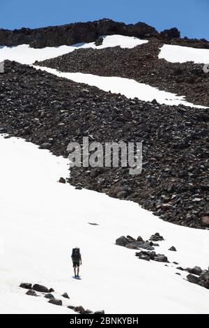 A climber on a snowy slope on Mount Ruapehu, Tongariro National Park, New Zealand