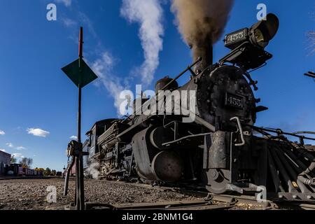 Steam locomotive building steam for work hauling passengers, at the Chama Station of the Cumbres & Toltec Scenic Railroad in Chama, New Mexico, USA Stock Photo