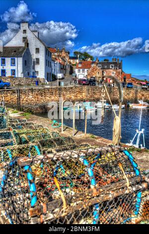 Town of Crail, Scotland. Artistic view of Crail cobbled harbour with lobster pots in the foreground, and harbour residences in the background. Stock Photo