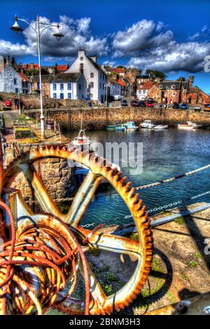 Town of Crail, Scotland. Artistic sunny view of rusted lifting gear on Crail harbour wall. Stock Photo