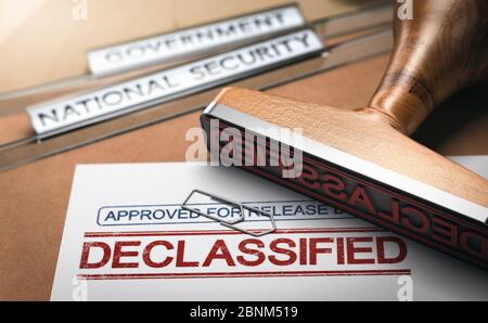 3D illustration of two folders and a rubber stamp with the word declassified printed on a document. Declassification of sensitive data and freedom of Stock Photo