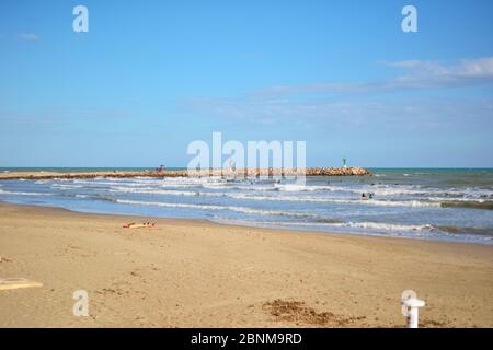 Group of surfers on the beach on a summer day. Colors of nature Stock Photo