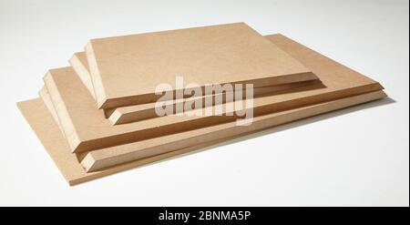 Construction of a shelf made of wood, Euro pallet, solid wood, MDF board; Do-it-yourself production, material photo of individual parts of the MDF board sawn to size Stock Photo