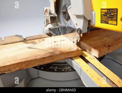 Construction of a shelf made of wood, Euro pallet, solid wood, MDF board; Do-it-yourself production, step-by-step, step 3 Cut the boards to size with a chop saw Stock Photo