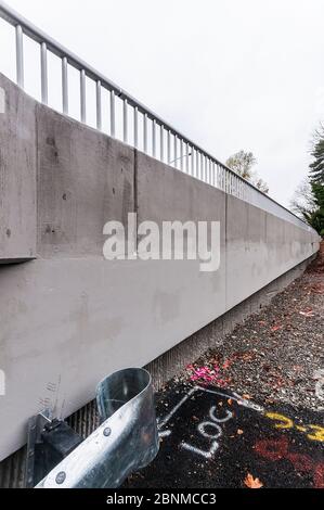 45th Street Viaduct Concrete Construction, Seattle, Washington, showing parking area to the side with metal guardrail. Stock Photo