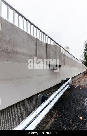 45th Street Viaduct Concrete Construction, Seattle, Washington, showing parking area to the side with metal guardrail. Stock Photo