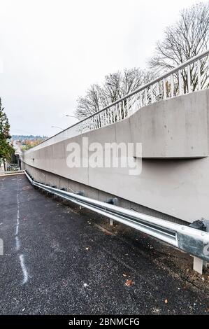 45th Street Viaduct Concrete Construction, Seattle, Washington, showing parking area to the side with metal guardrail. Stock Photo