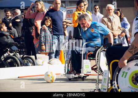 Valencia, Spain. February 15, 2020 - Adaptive sports day. Some adaptive soccer or football players playing in the town hall square Stock Photo