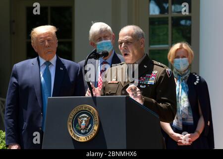 United States President Donald J. Trump listens as General Gustave Perna delivers remarks regarding Coronavirus vaccine developments in the Rose Garden of the White House in Washington, DC, U.S. on Friday, May 15, 2020. Credit: Stefani Reynolds/CNP /MediaPunch Stock Photo