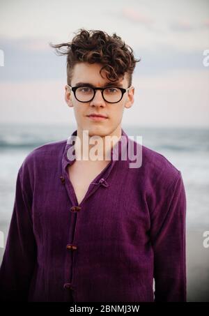 portrait of young man on the beach Stock Photo