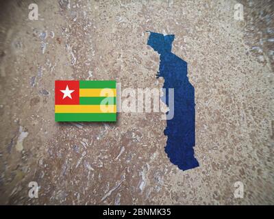 Map and flag of Togo on a concrete background. Stock Photo