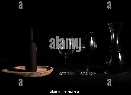 Wine glasses with bottle and pourer. Two wine glasses with wine utensils for the bottle, bottle and decorations Stock Photo