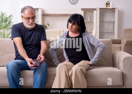 Old couple having argument at the home Stock Photo