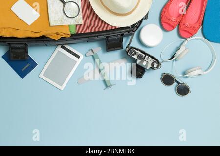 Travel concept. Suitcase with tourist things. Copy space. Stock Photo