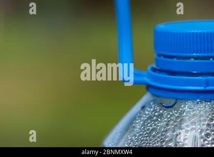 Top part of a five liter plastic bottle, coated inside with condensate Stock Photo