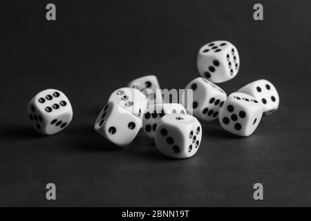 various tumbling dice on a black background in landscape format Stock Photo