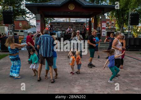 4 piecce rock-blues band performing in outdoor concert. Stock Photo