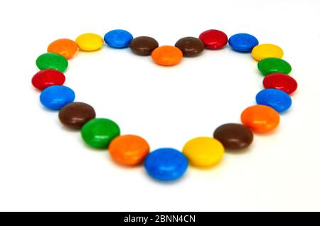 colorful chocolate buttons on white background Stock Photo