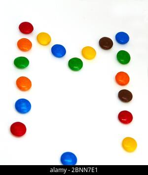 colorful chocolate buttons on a white background Stock Photo