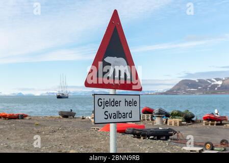 Attention - polar bear warning signs in Longyearbyen, Svalbard archipelago, Norway (Translations for non-English text: 'Applies to all of Svalbard' Stock Photo