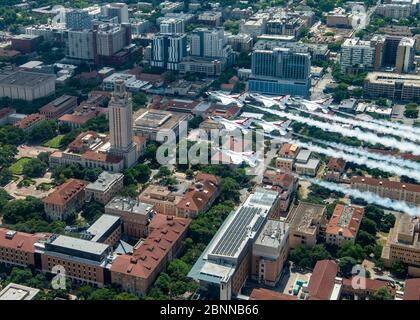 The U.S. Air Force Air Demonstration Squadron, the Thunderbirds fly in formation over the University of Texas, during the America Strong flyover May 13, 2020 in Austin, Texas. America Strong is a salute from the Navy and Air Force to recognize healthcare workers, first responders, and other essential personnel in a show of national solidarity during the COVID-19 pandemic. Stock Photo