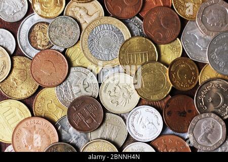 Picture Full Of Metal Coins From Different Countries including new and old coins Stock Photo