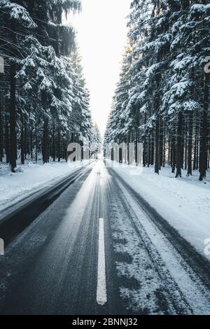 Germany, Saxony, Ore Mountains, Greifensteine, country road in winter Stock Photo