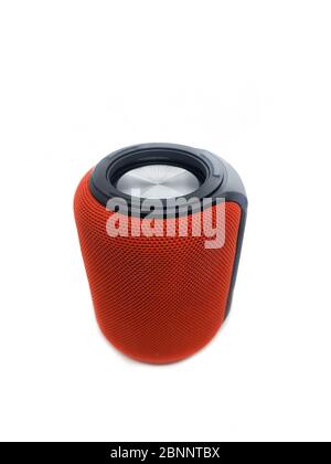 Mini red bluetooth speaker isolated on over white background. Stock Photo