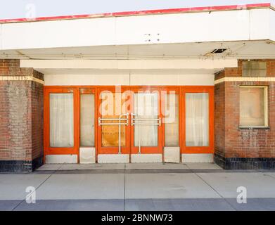 An abandoned theater building in the downtown of Coleman in the Crownest community in Alberta Stock Photo
