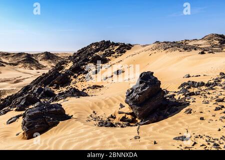 Deserts, sand, dunes, salt dome, red sand, red dunes, rock, mountain, elevation, blue sky, midday light Stock Photo