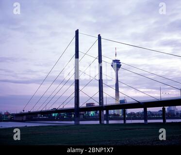 Panoramic view of Rheinkniebrücke (Rhine Knee Bridge) and the Rheinturm (Rhine Tower) over the Rhine River.  Düsseldorf, Germany Stock Photo