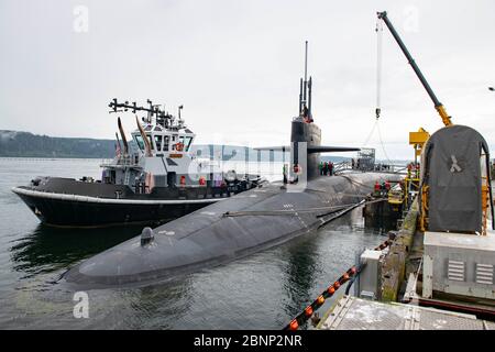 The U.S. Navy Ohio-class nuclear-powered ballistic missile USS Maine returns to to strategic service following a three year overhaul and refueling May 2, 2020 in Silverdale, Washington. Guided-missile submarines are capable of carrying 154 Tomahawk land-attack cruise missiles and host up to 66 Special Operation Forces. Stock Photo