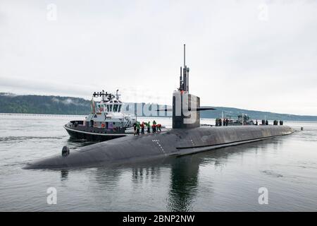 The U.S. Navy Ohio-class nuclear-powered ballistic missile USS Maine returns to to strategic service following a three year overhaul and refueling May 2, 2020 in Silverdale, Washington. Guided-missile submarines are capable of carrying 154 Tomahawk land-attack cruise missiles and host up to 66 Special Operation Forces. Stock Photo